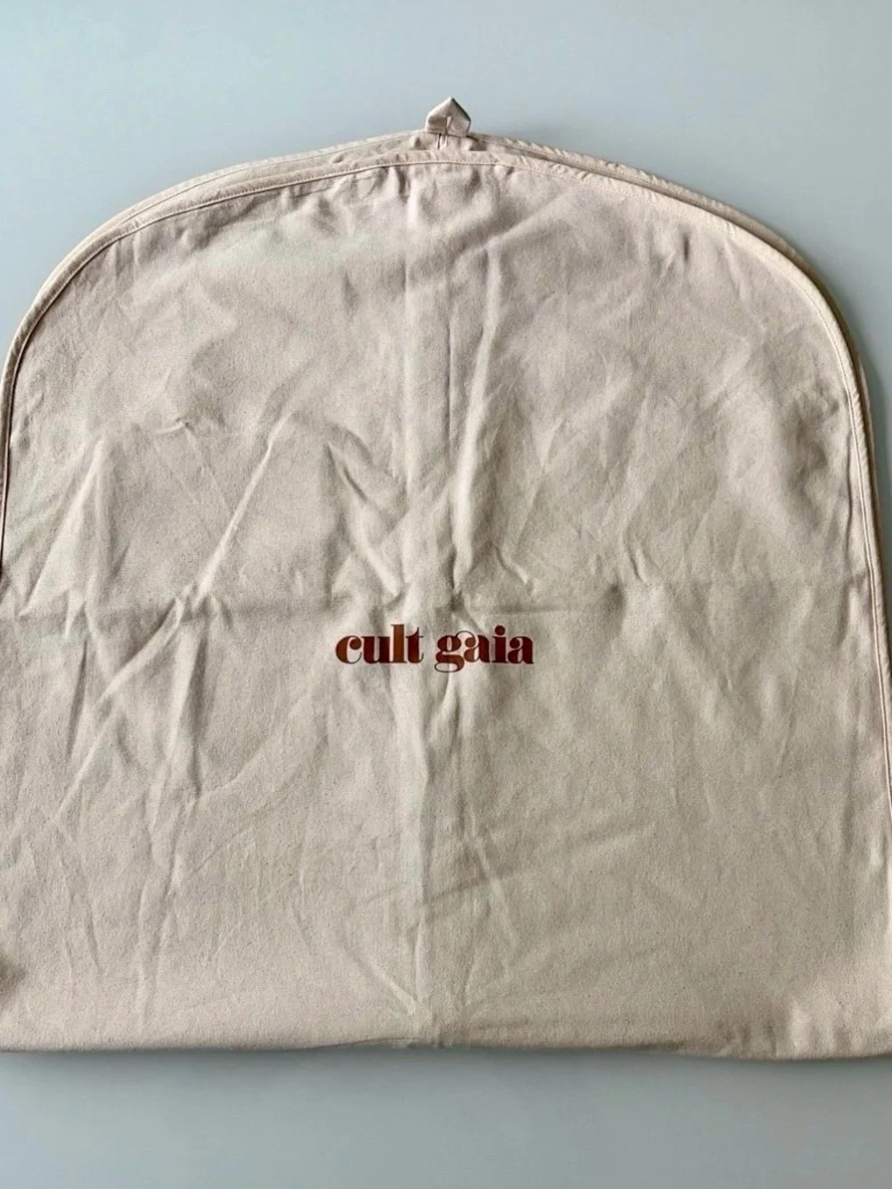 Cult Gaia Canvas Garment Cover in Beige with Red Logo 50”x 24”